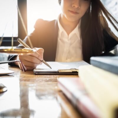 close-up-lawyer-businessman-working-reading-lawbook-office-workplace-consultant-lawyer-concept